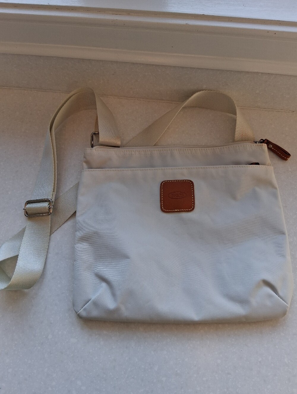 Bric's Cream Crossbody Bag with Tan Leather Patch